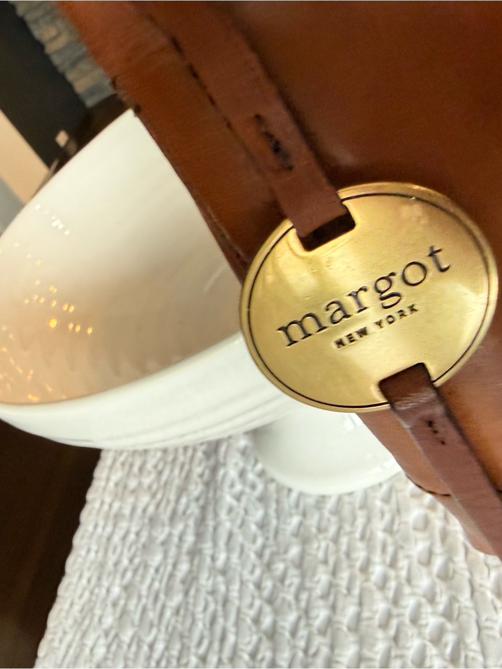 Margot New York Tan Crossbody Bag with Gold Logo Medallion